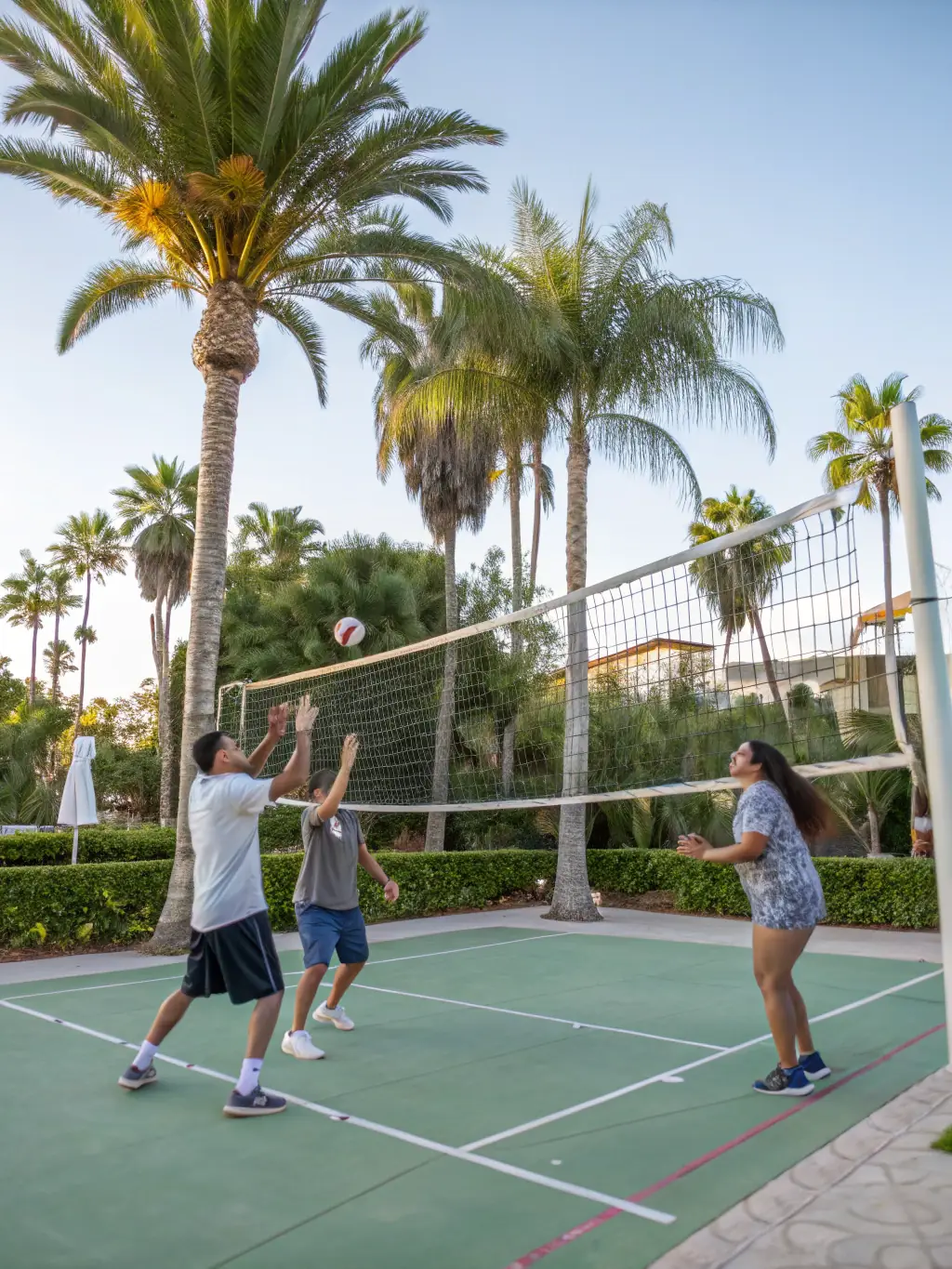 Image of adult volleyball players participating in a recreational league game at LOUVIERS ARCHE VOLCHE VOLLEY BALL, showcasing the fun and social aspect of the sport.