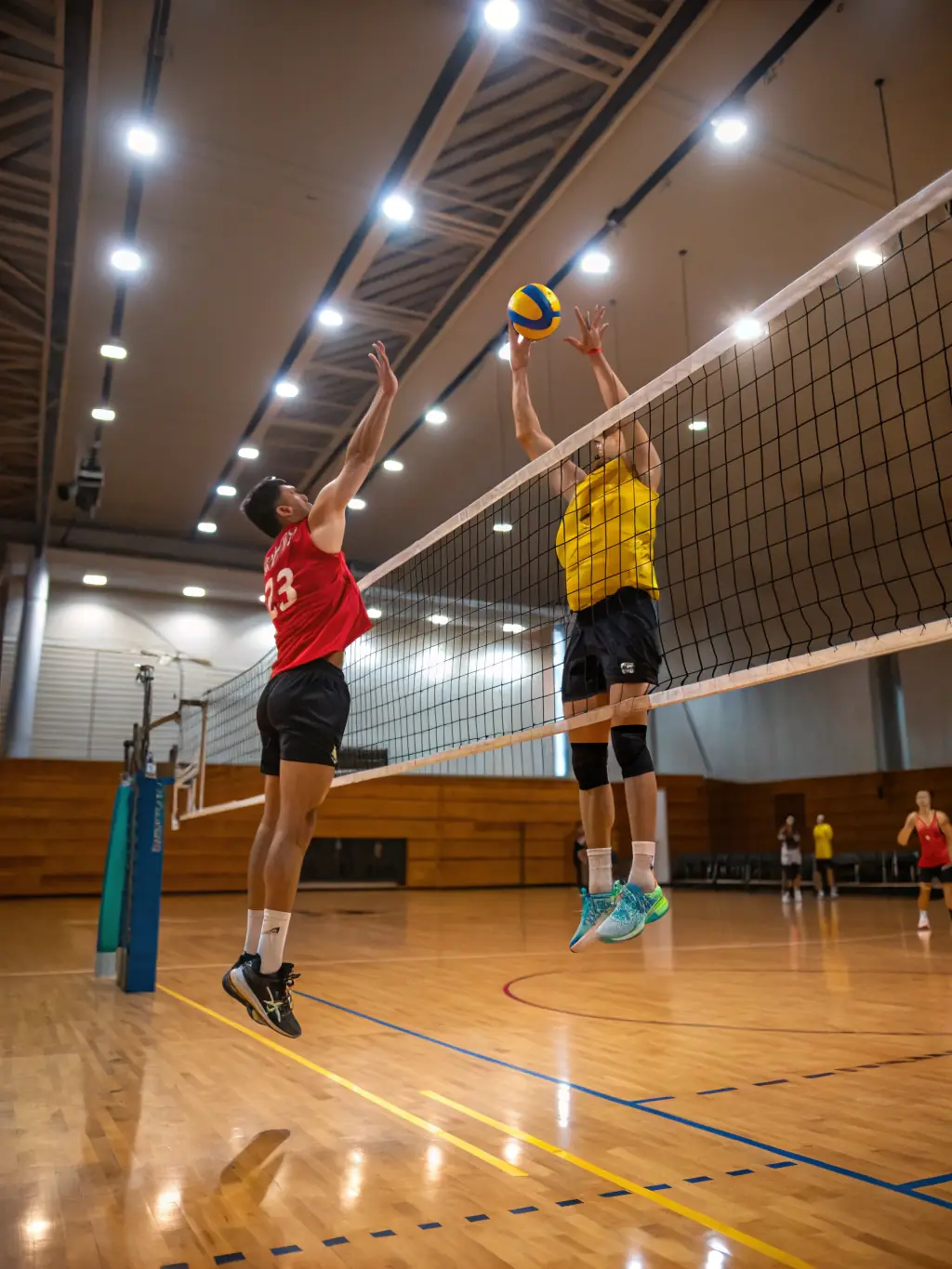 A dynamic shot of adult players engaged in a competitive volleyball match at LOUVIERS ARCHE VOLLEY BALL, showcasing skill and sportsmanship.